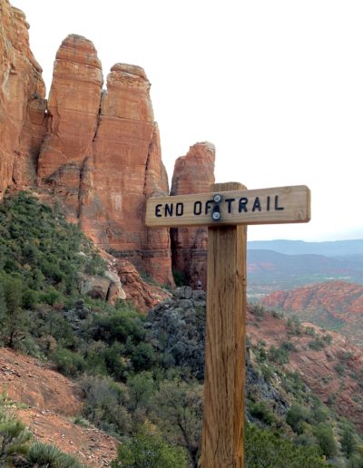 Brown End of Trail Sign Overlooking Canyon at Sunset