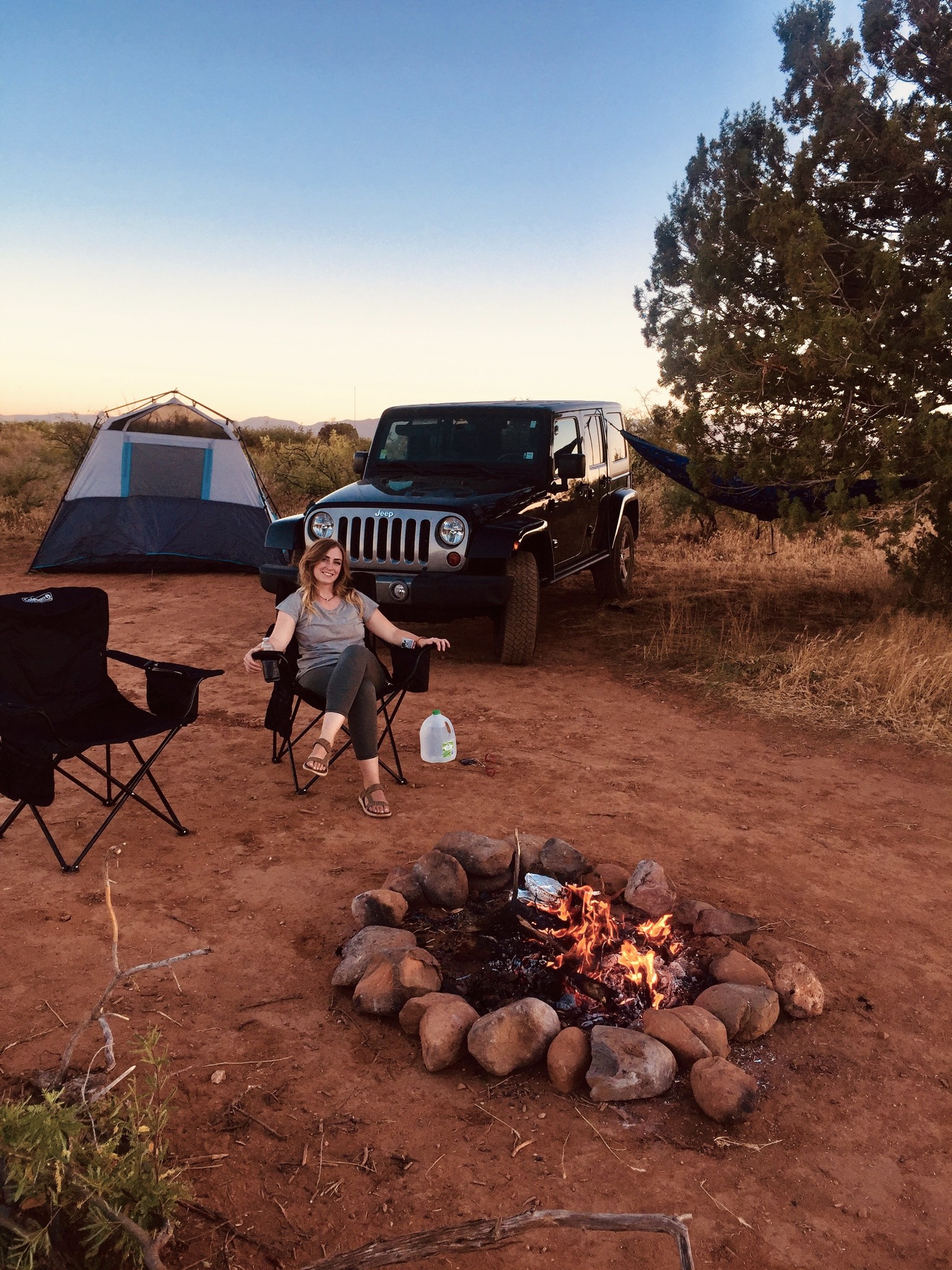 Campsite with Jeep, Tent, Chair, and Fire