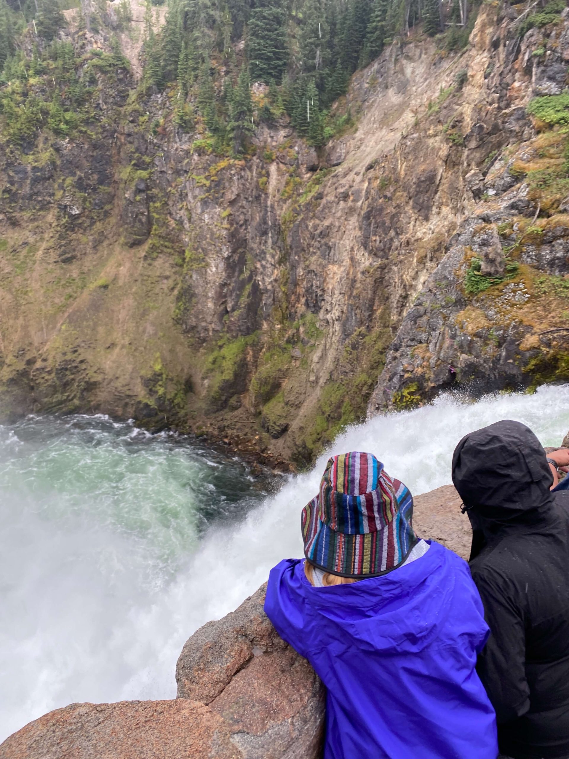 Two People Overlooking a Waterfall