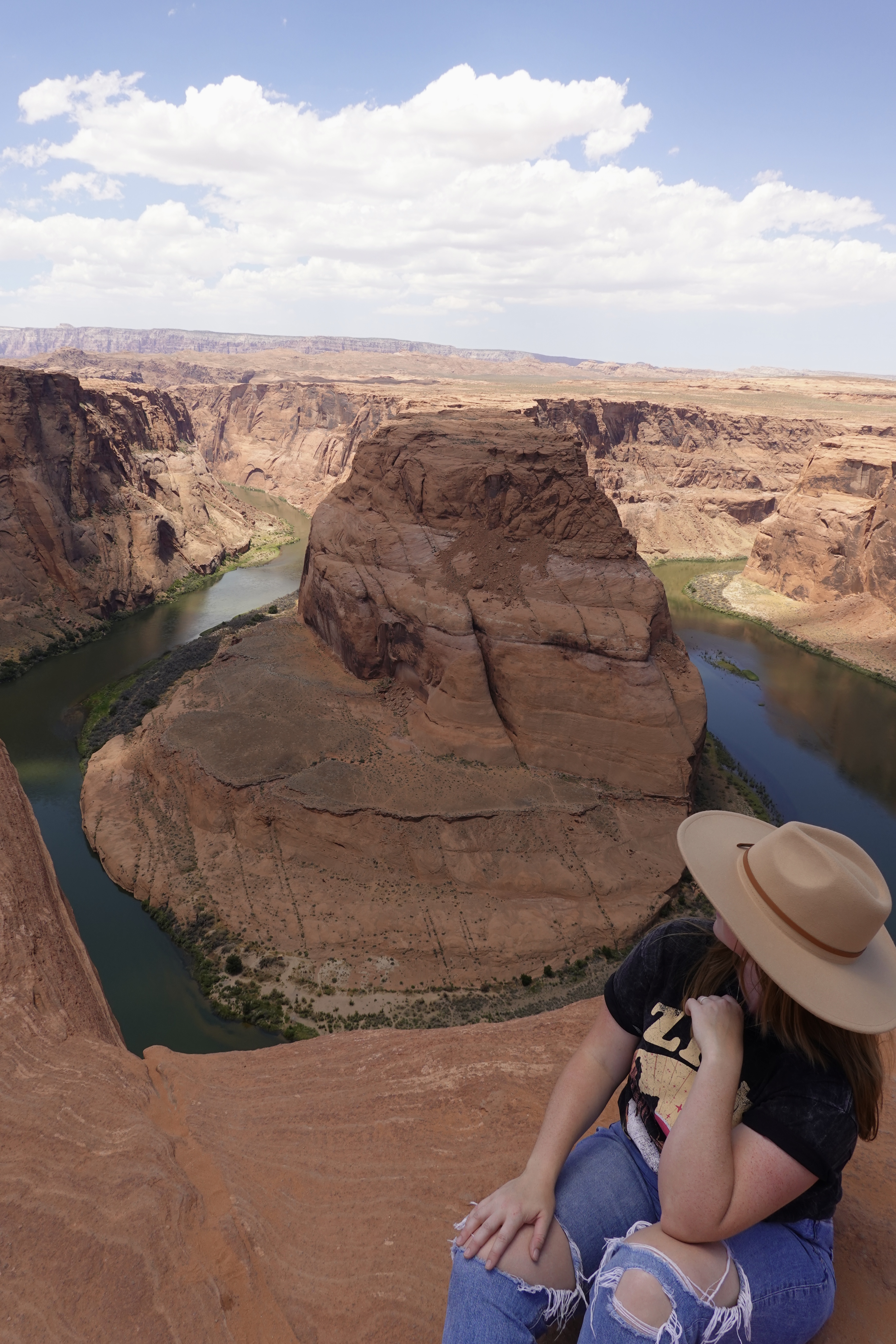 Girl Sitting in Front of Horseshoe Bend