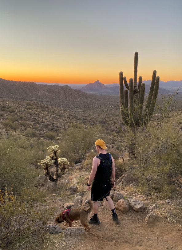 Dog and Man Hiking in the Desert
