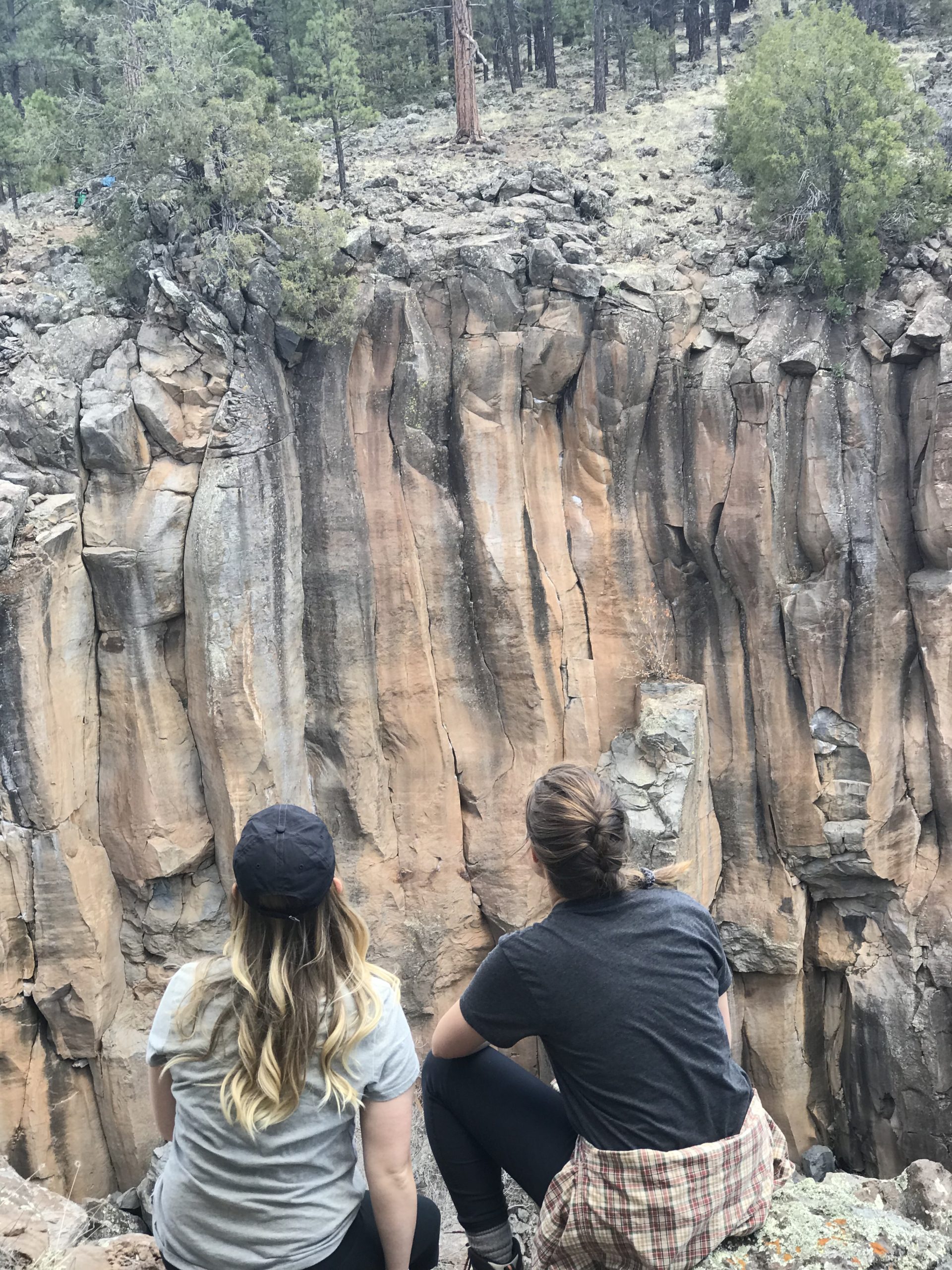 Two Girls Looking at a Canyon Wall