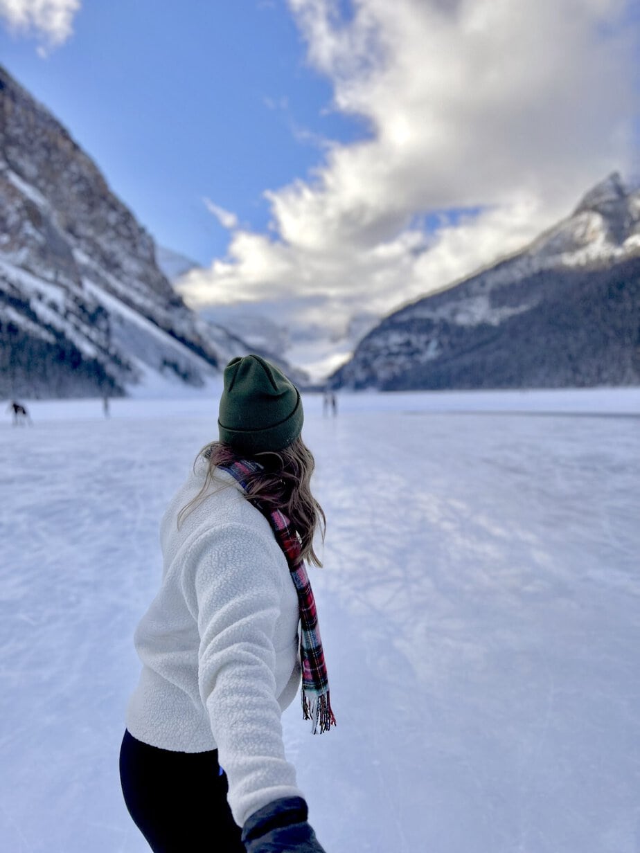 Girl in a White Jacket on a Frozen Lake