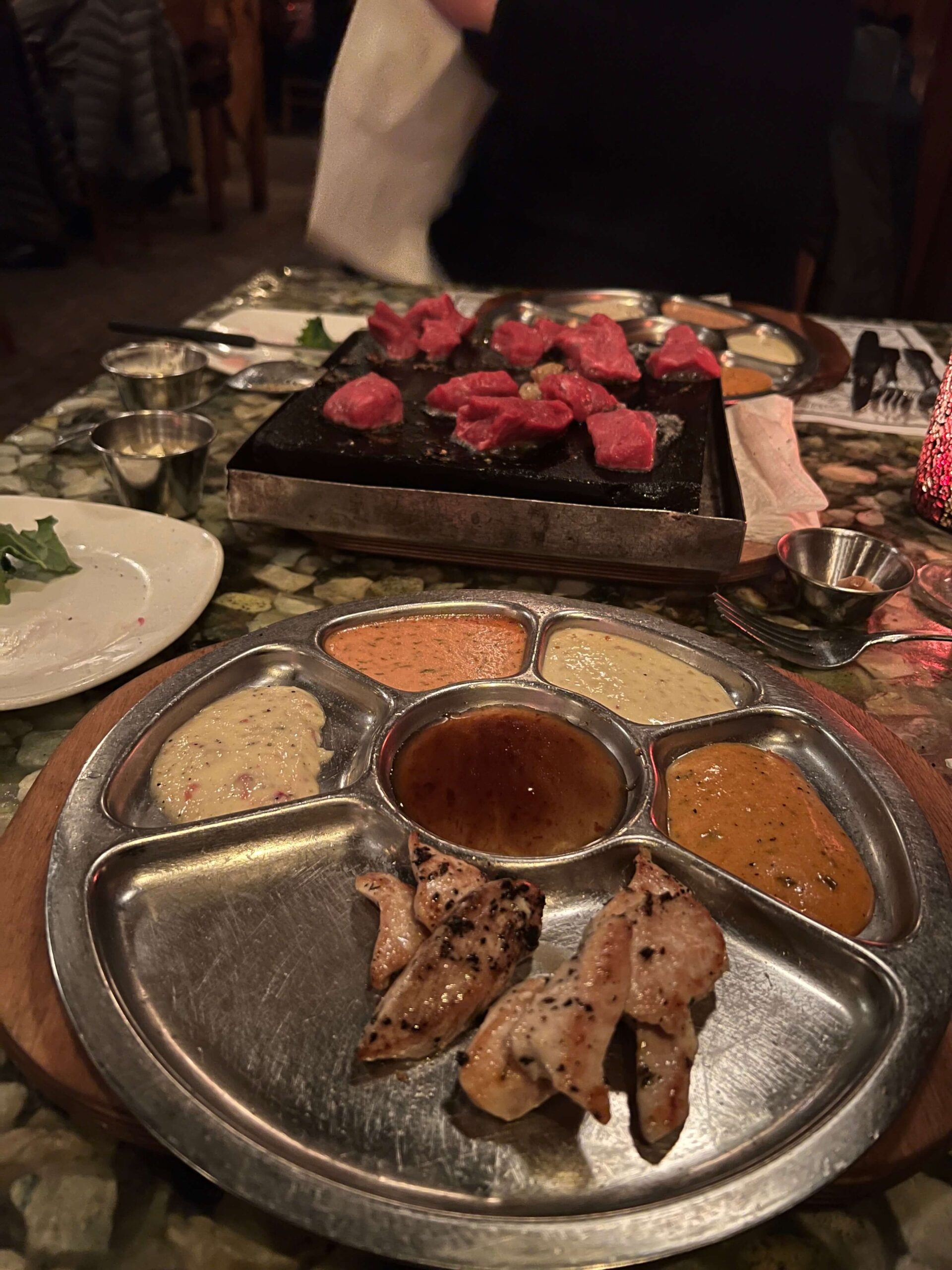 Meat with a Plate of Different Color Sauces