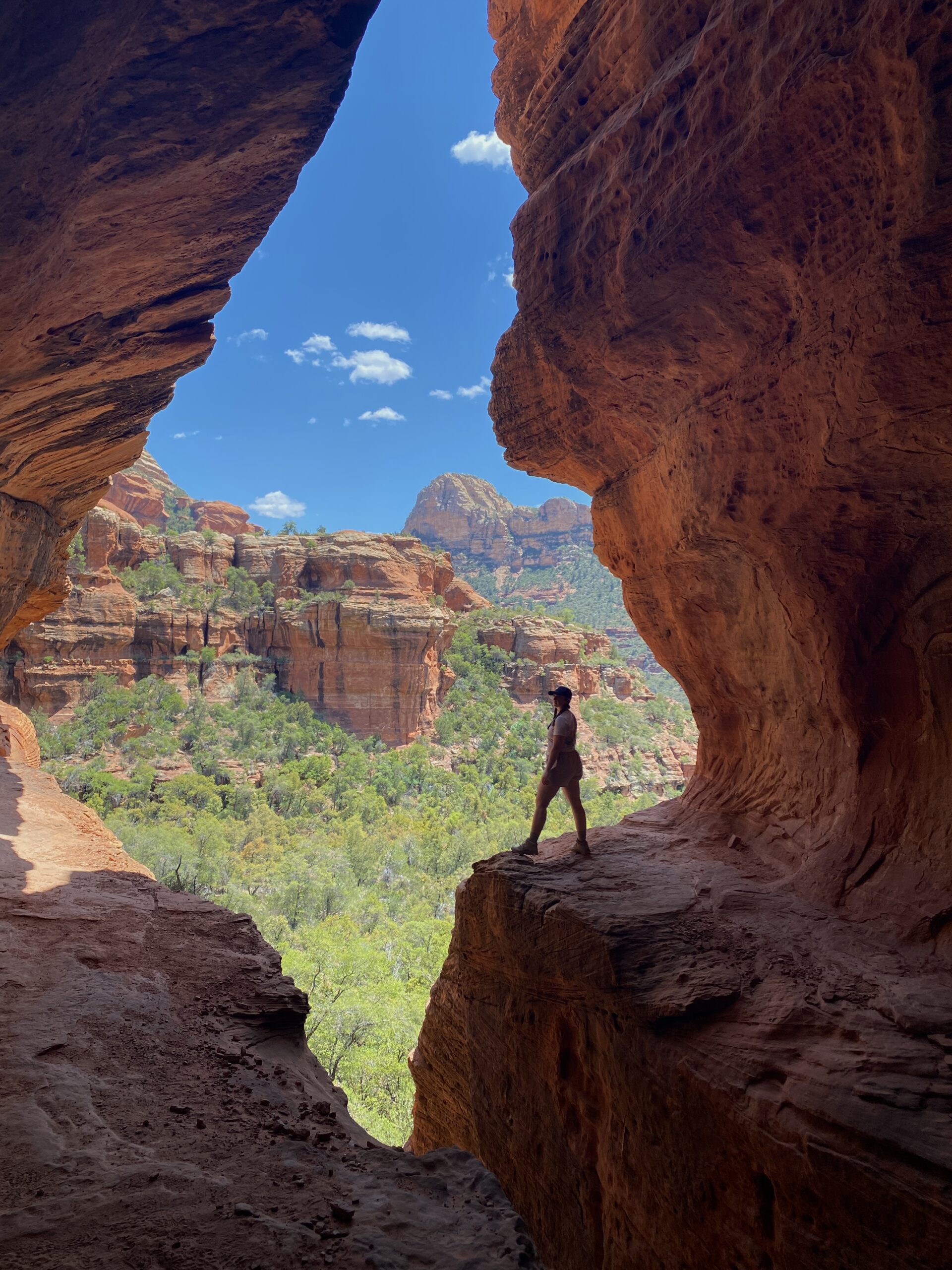 Girl Standing on a Rock in a Cave in Sedona Arizona