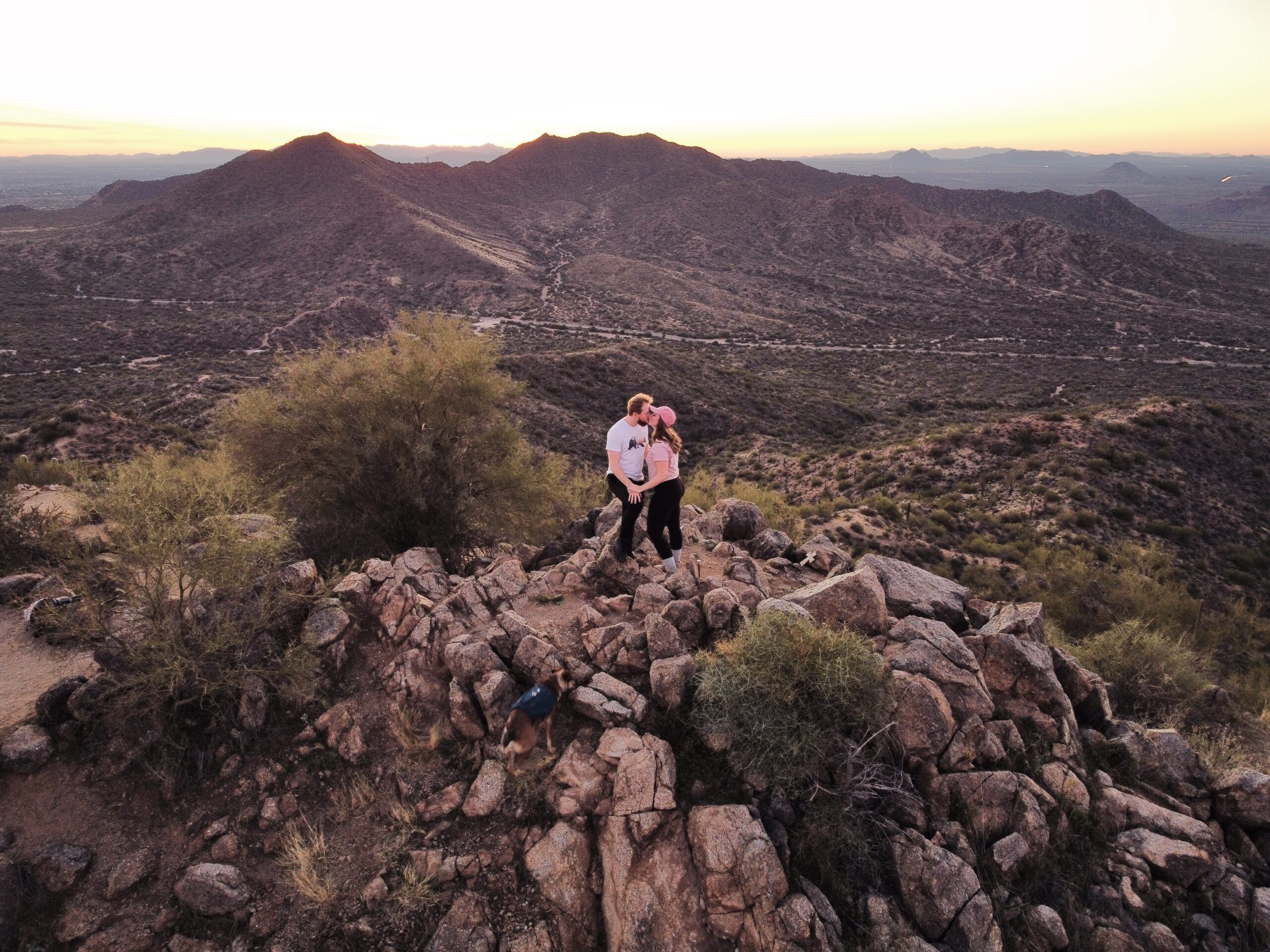 Couple Kissing at the Top of a Mountain