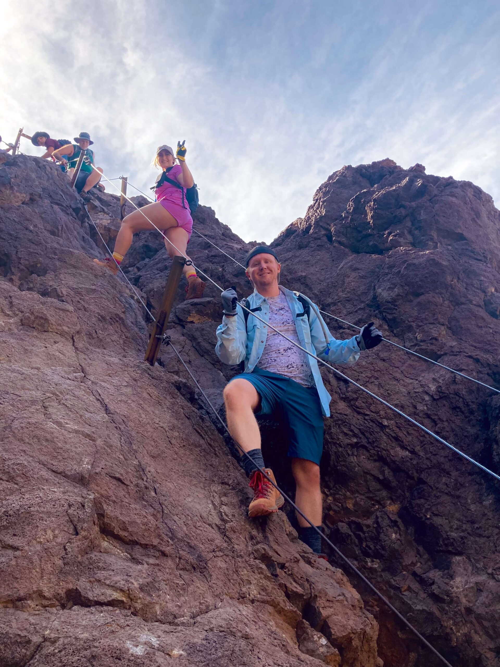 Two People Paused on a Mountain