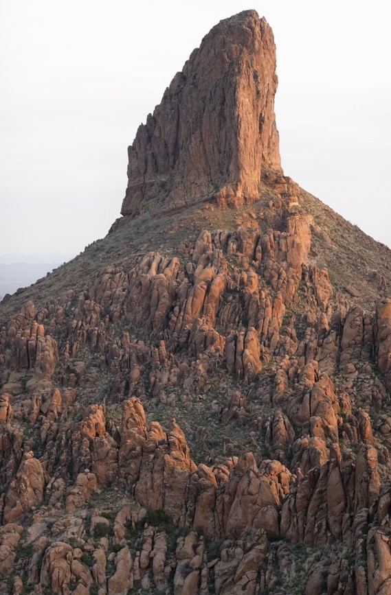 large monolith rock standing up 1,000 ft from the valley