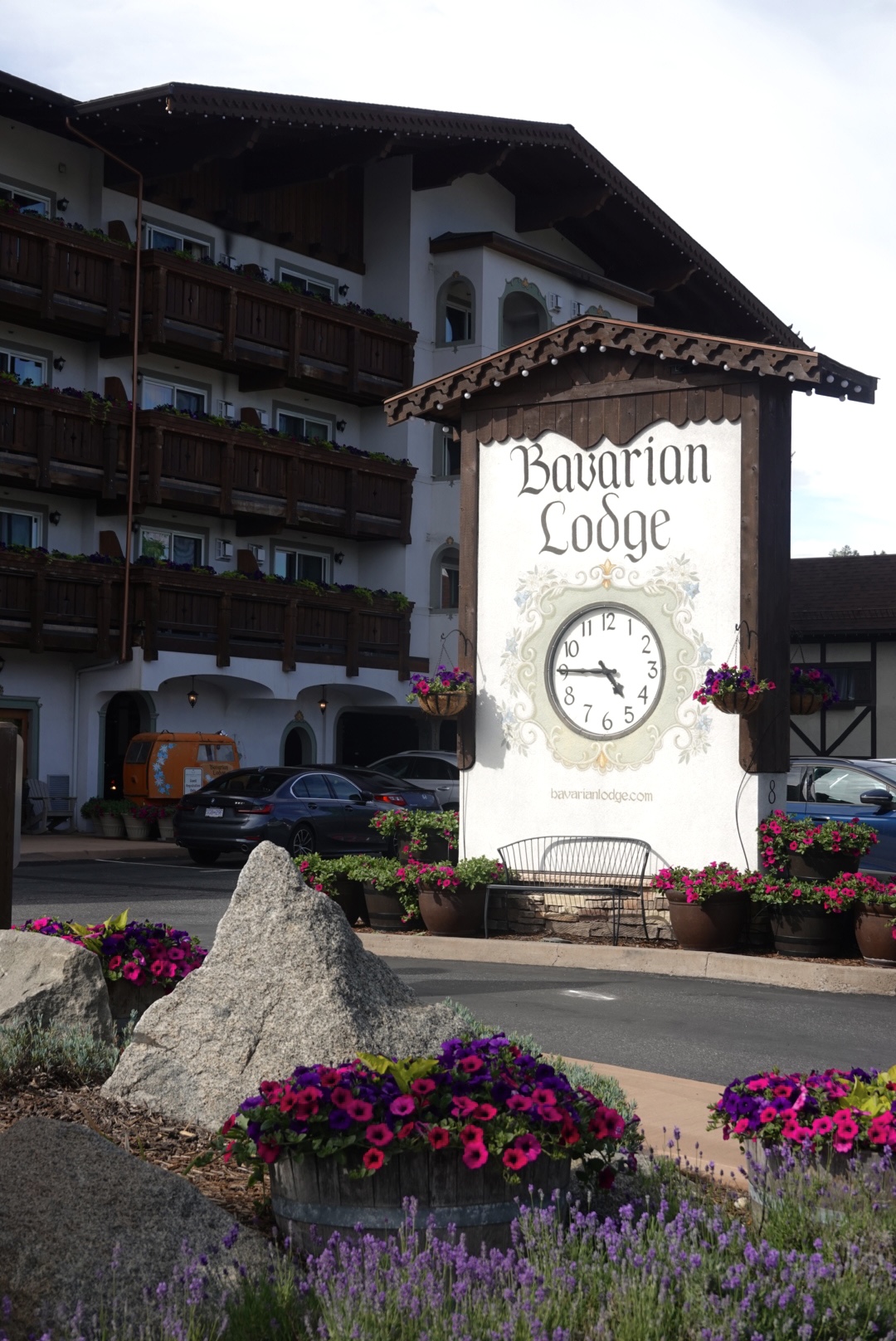 Hotel with Flowers Near the Sign Saying Bavarian Lodge