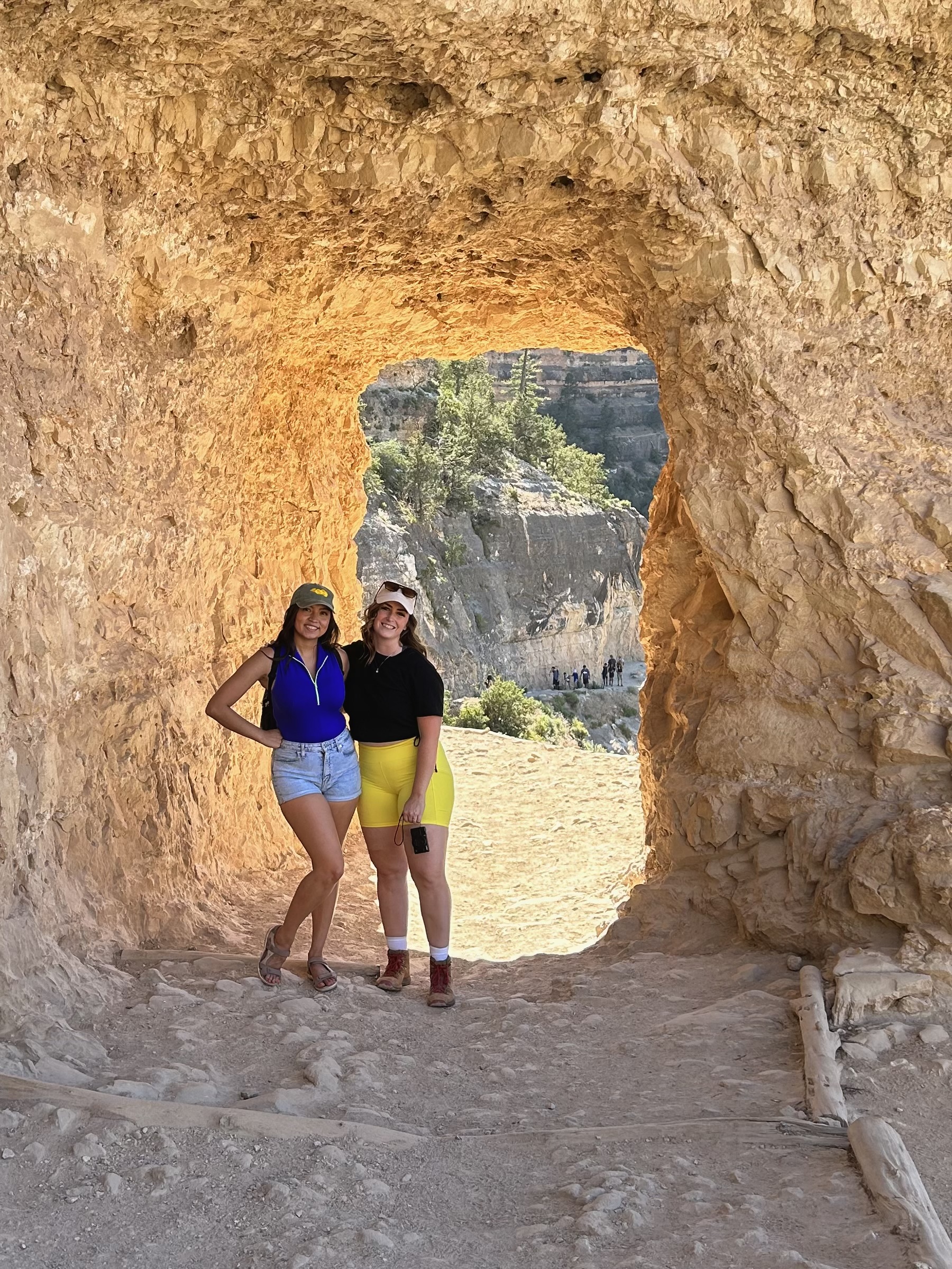 two girls in a rock tunnel