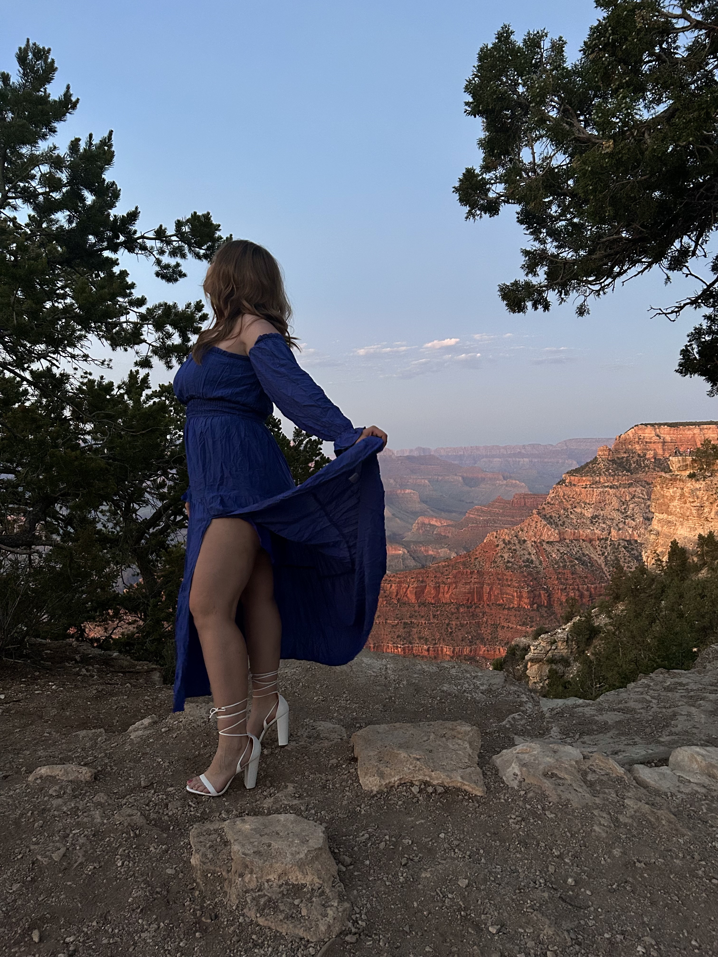 Girl in a Blue Dress in Heels on the Grand Canyon