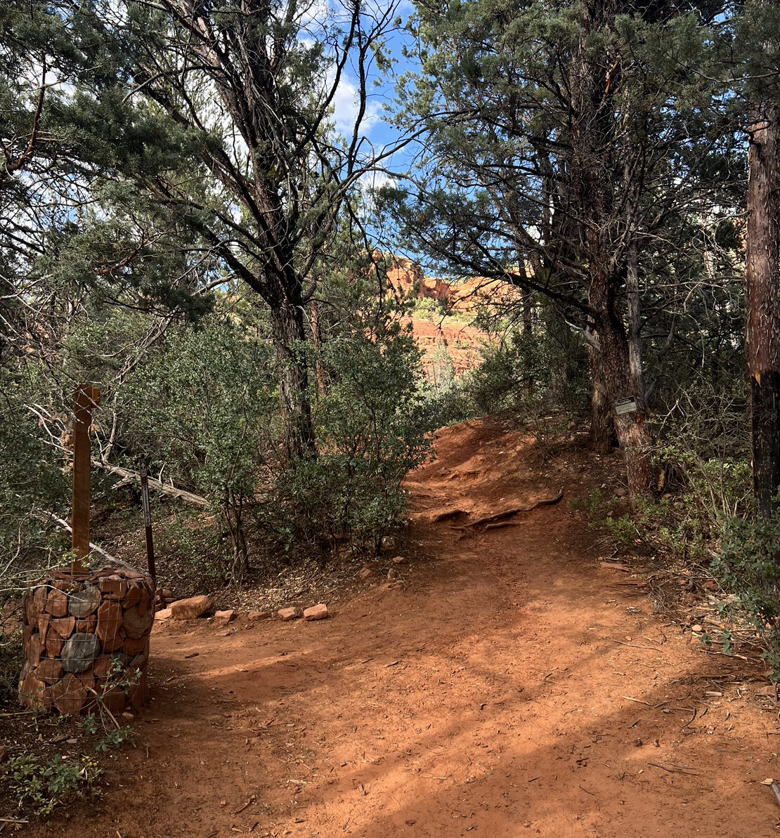 a fork in the path with red dirt
