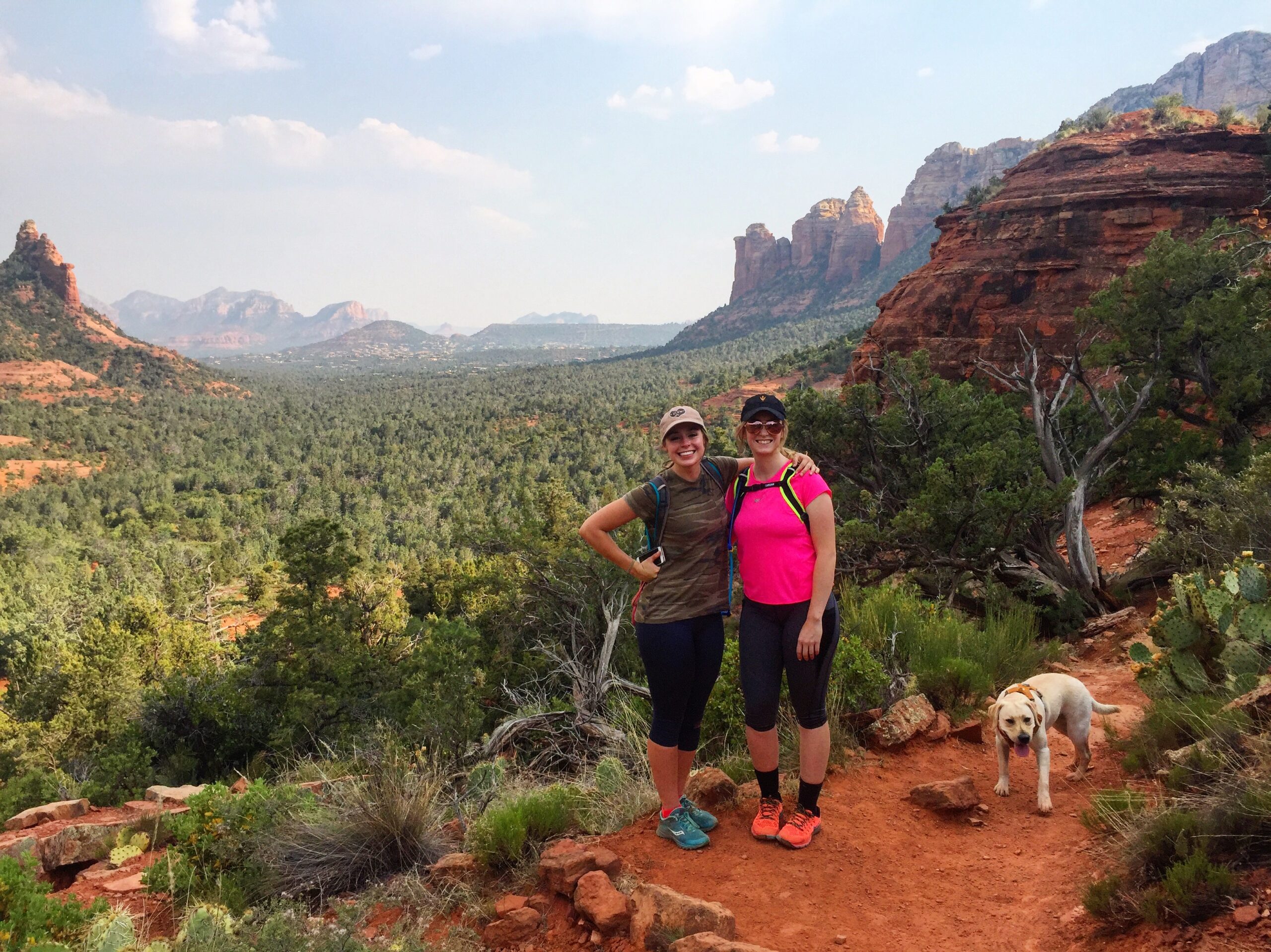 Girls Standing on a Trail Overlooking a Canyon