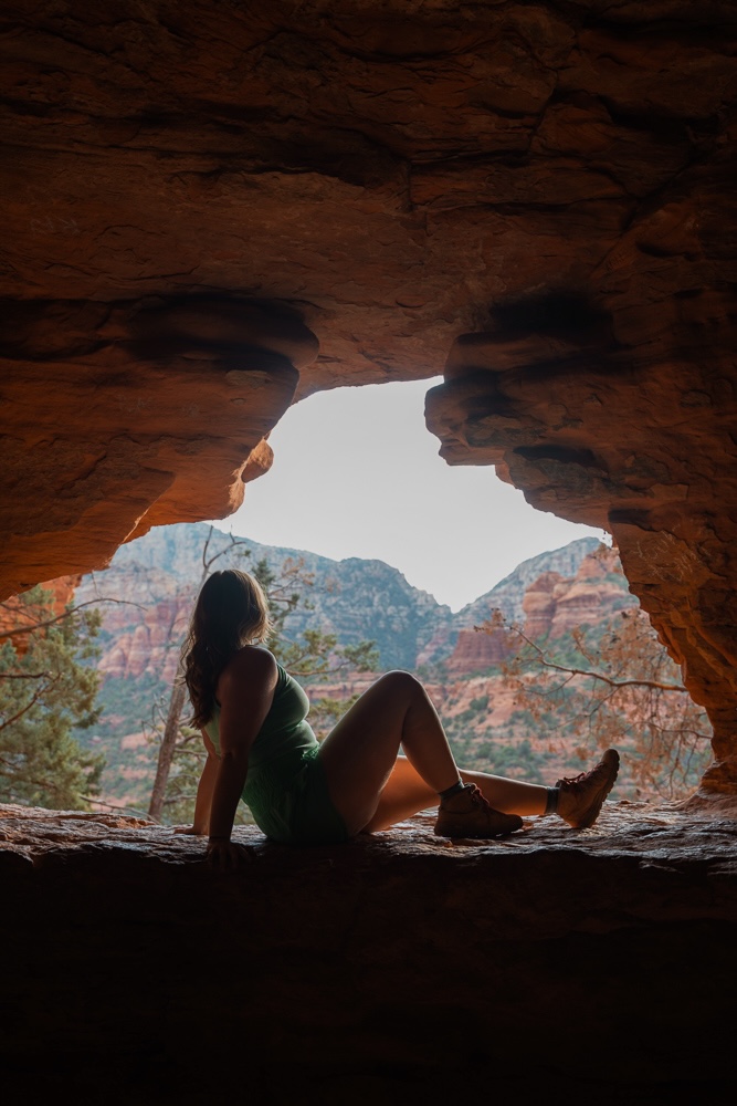 girl sitting in a cave