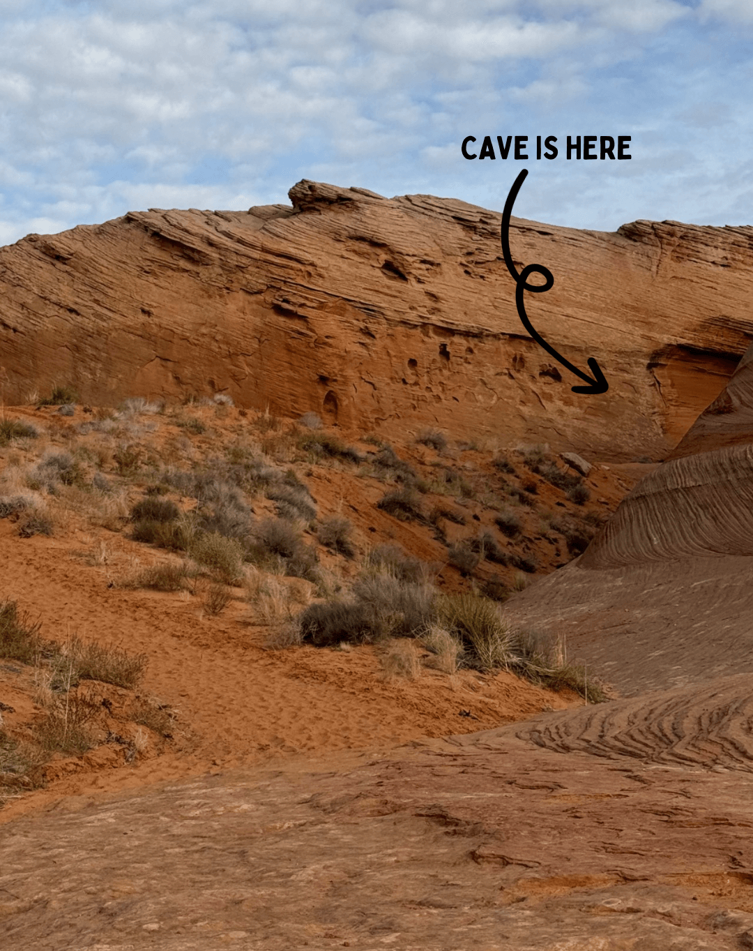 photo of a rock wall and text and an arrow