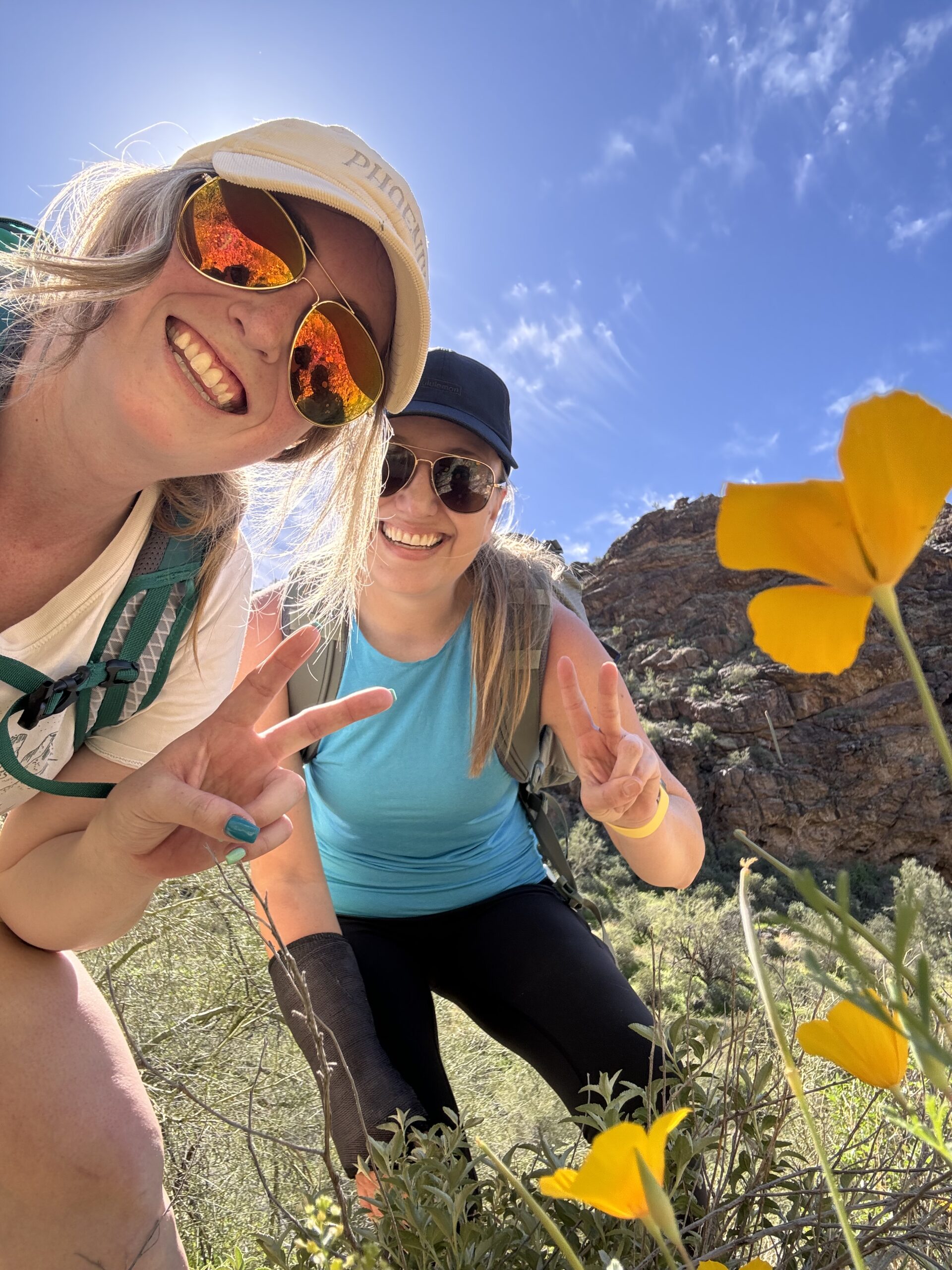 two girls near wildflowers in arizona