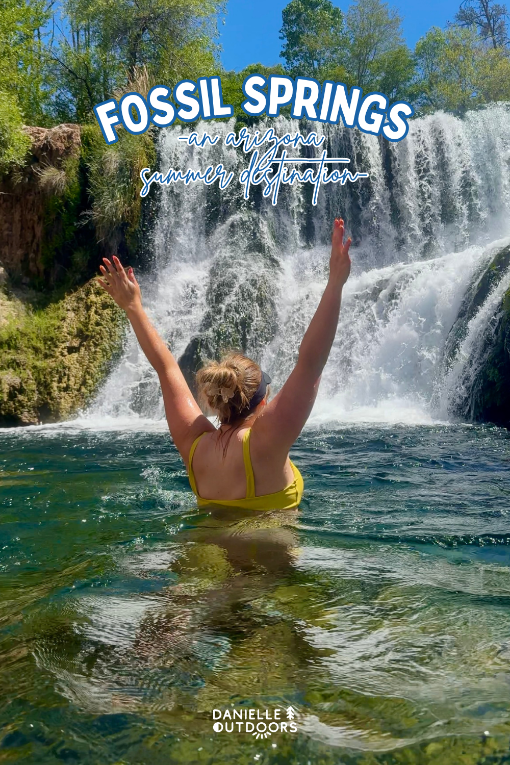 girl in yellow swimsuit by a waterfall