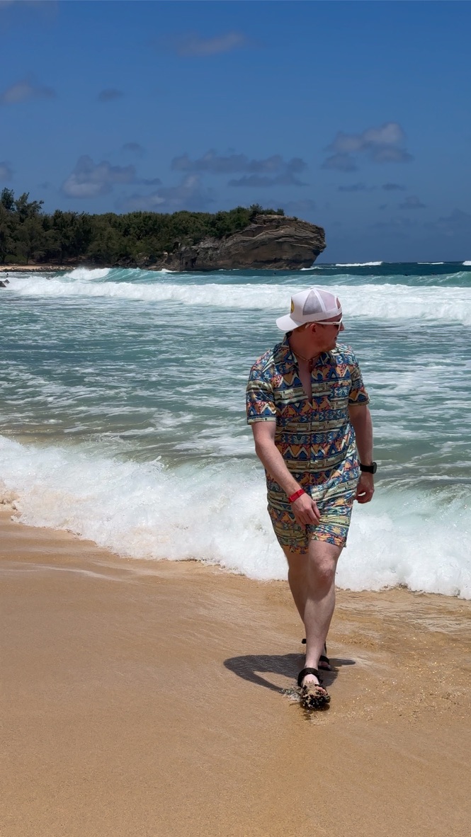 man waking on the beach