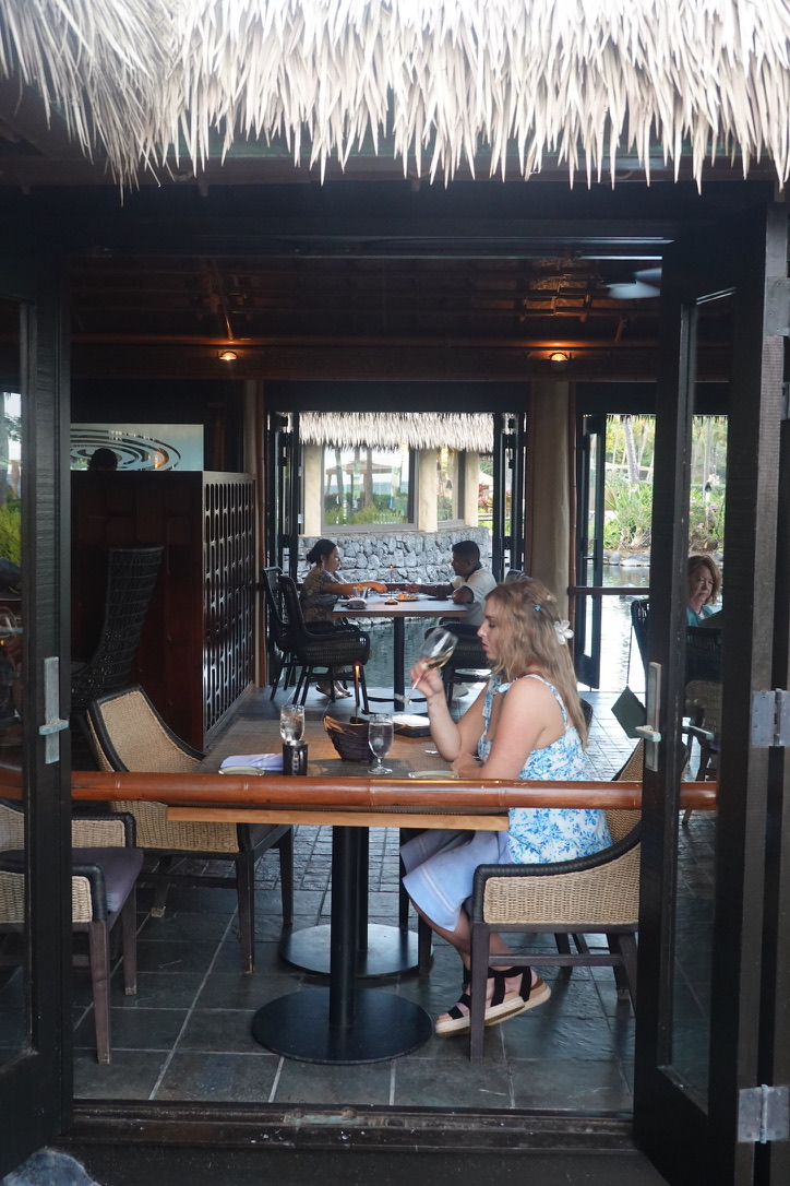 girl sitting for dinner at grand hyatt kauai