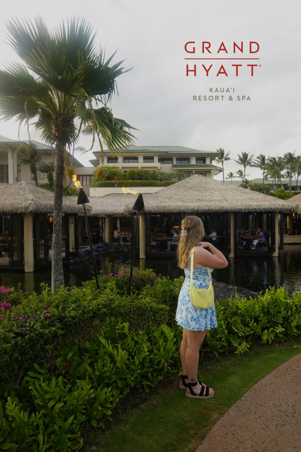 Girl in a dress in a beautiful resort in kauai