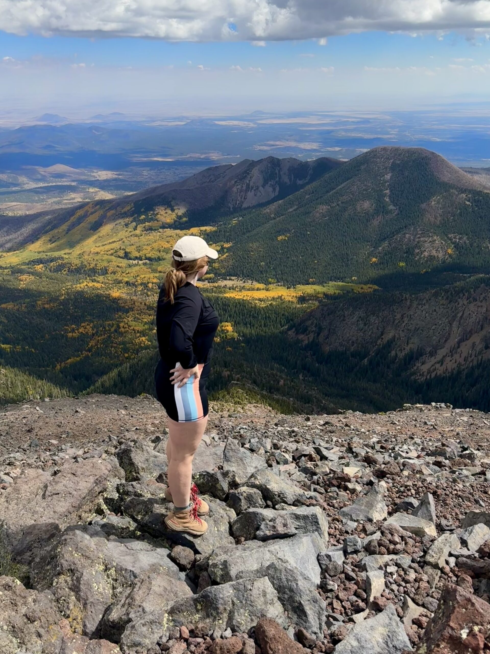 girl standing above fall colors in flagstaff