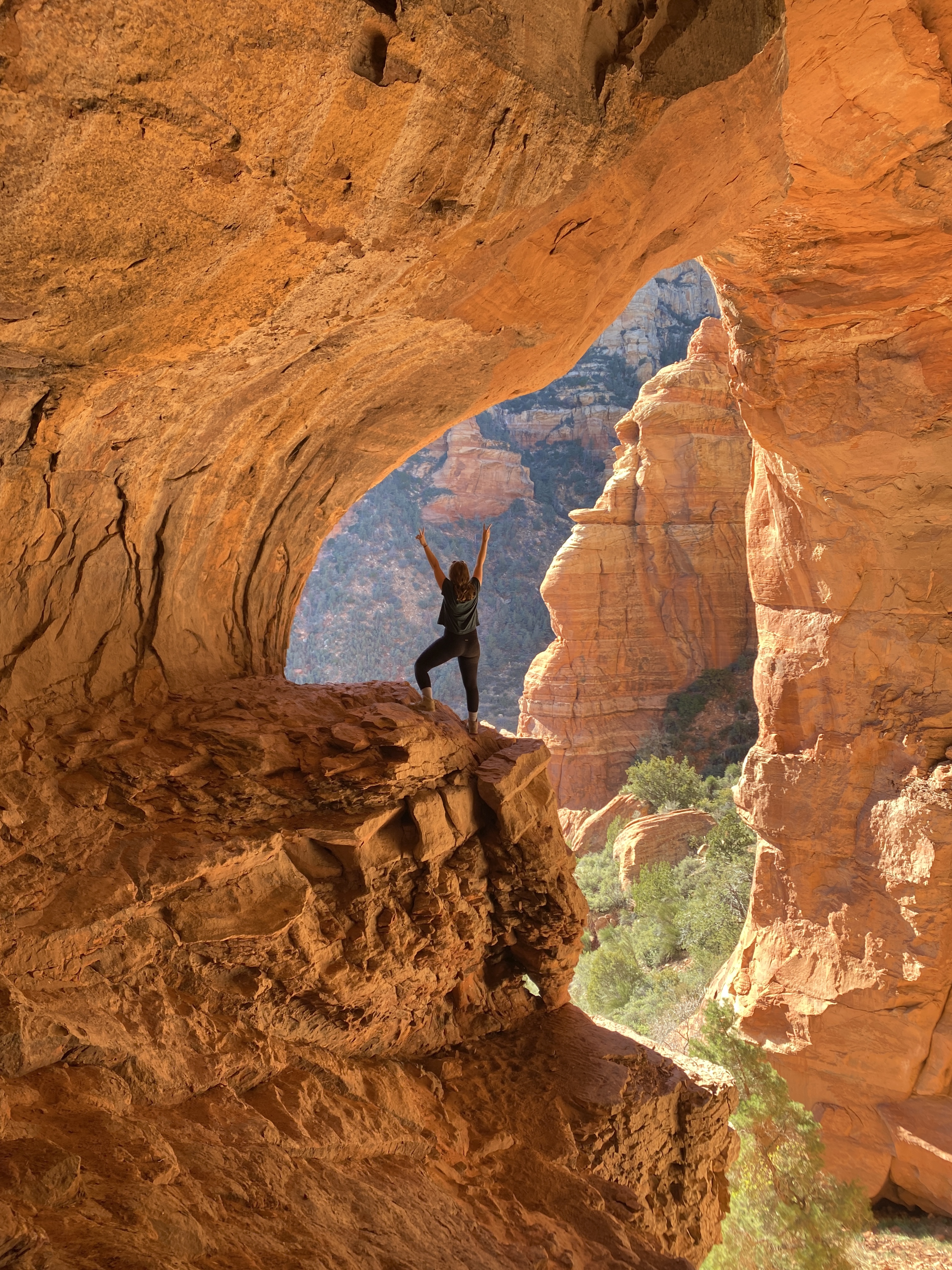 girl standing in a cave in sedona