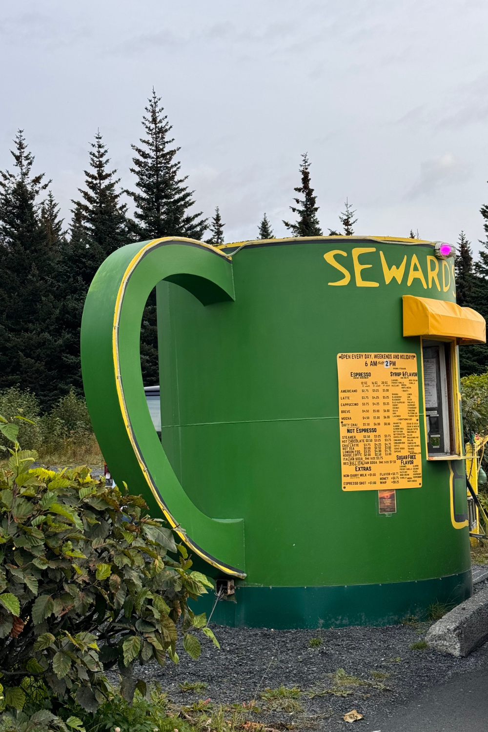 photo of a green coffee mug shaped coffee shop