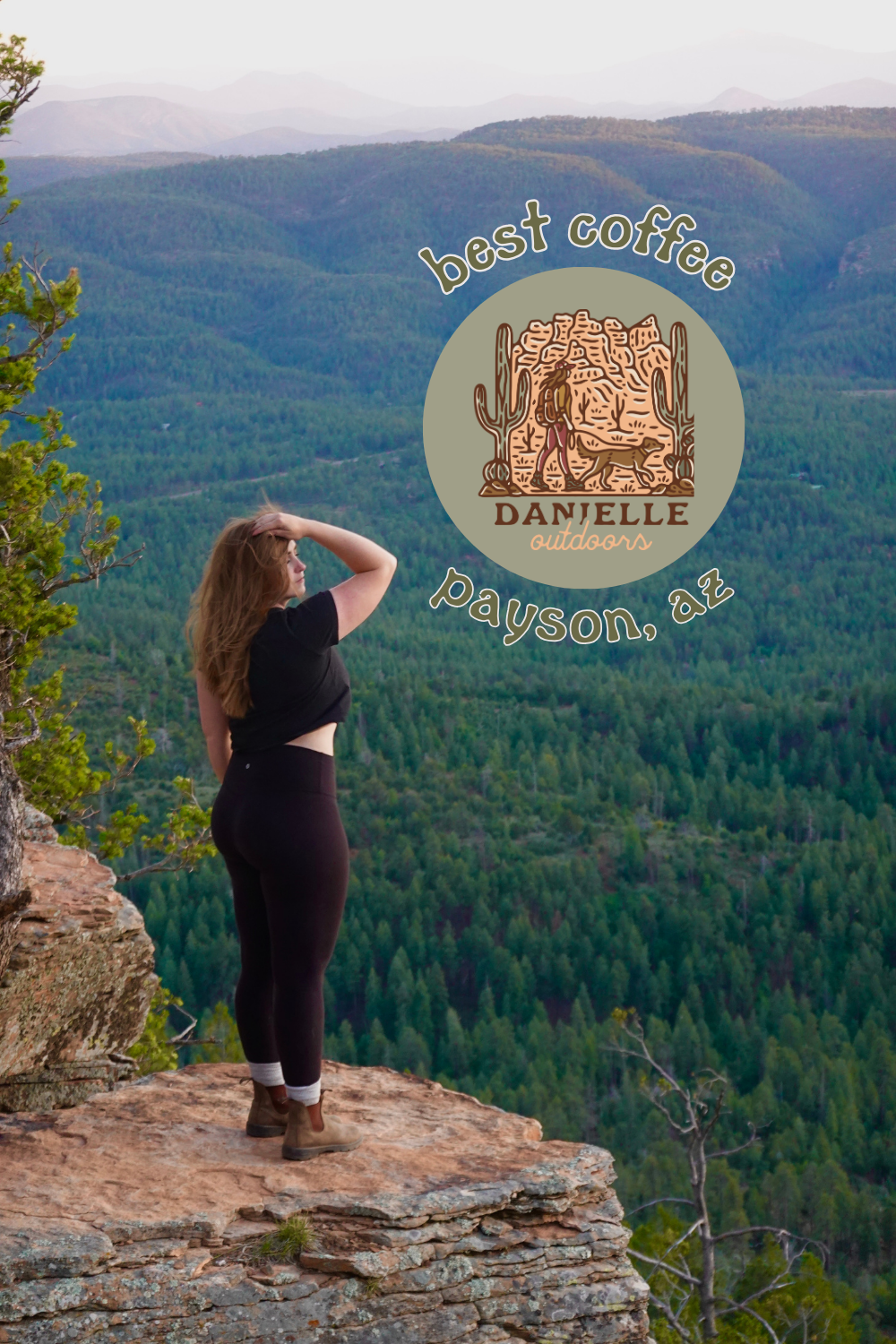 girl standing on the ledge looking over mountains