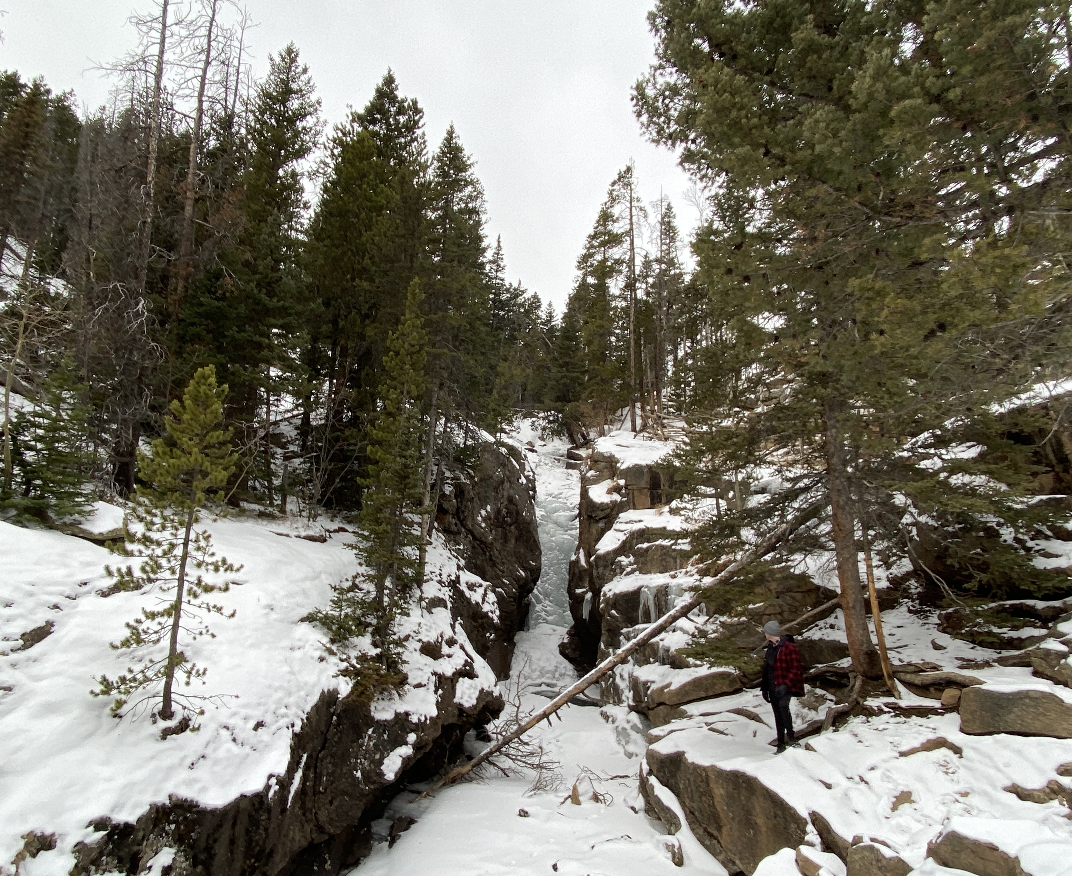 photo of a frozen waterfall in rocky mountain national park