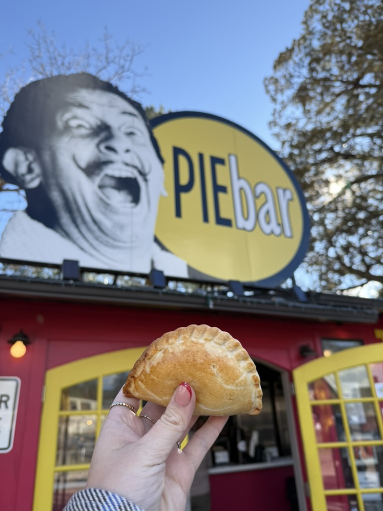 the pie bar photo of a pie in front of sign saying the pie bar