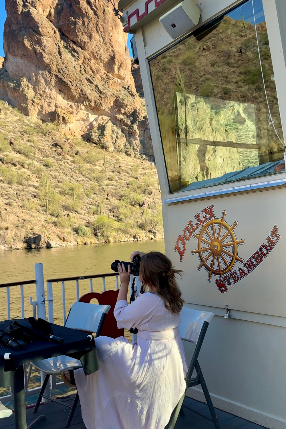 dolly steamboat cruise girl taking camera photo on dolly steamboat