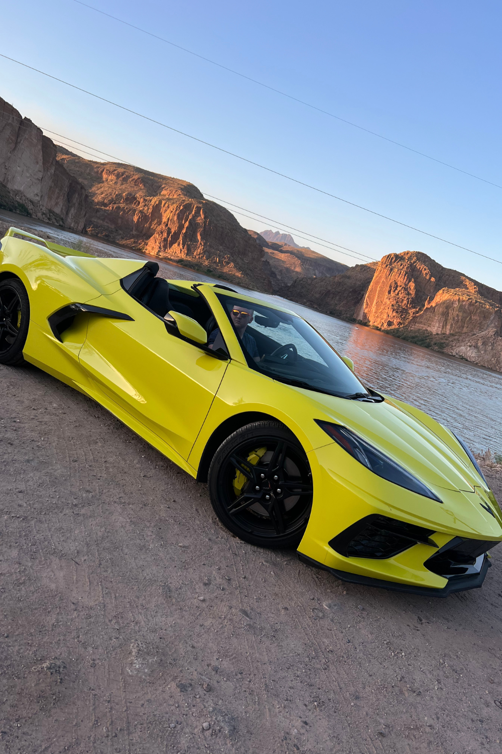 sports car canyon lake photo of a yellow sports car around canyon lake