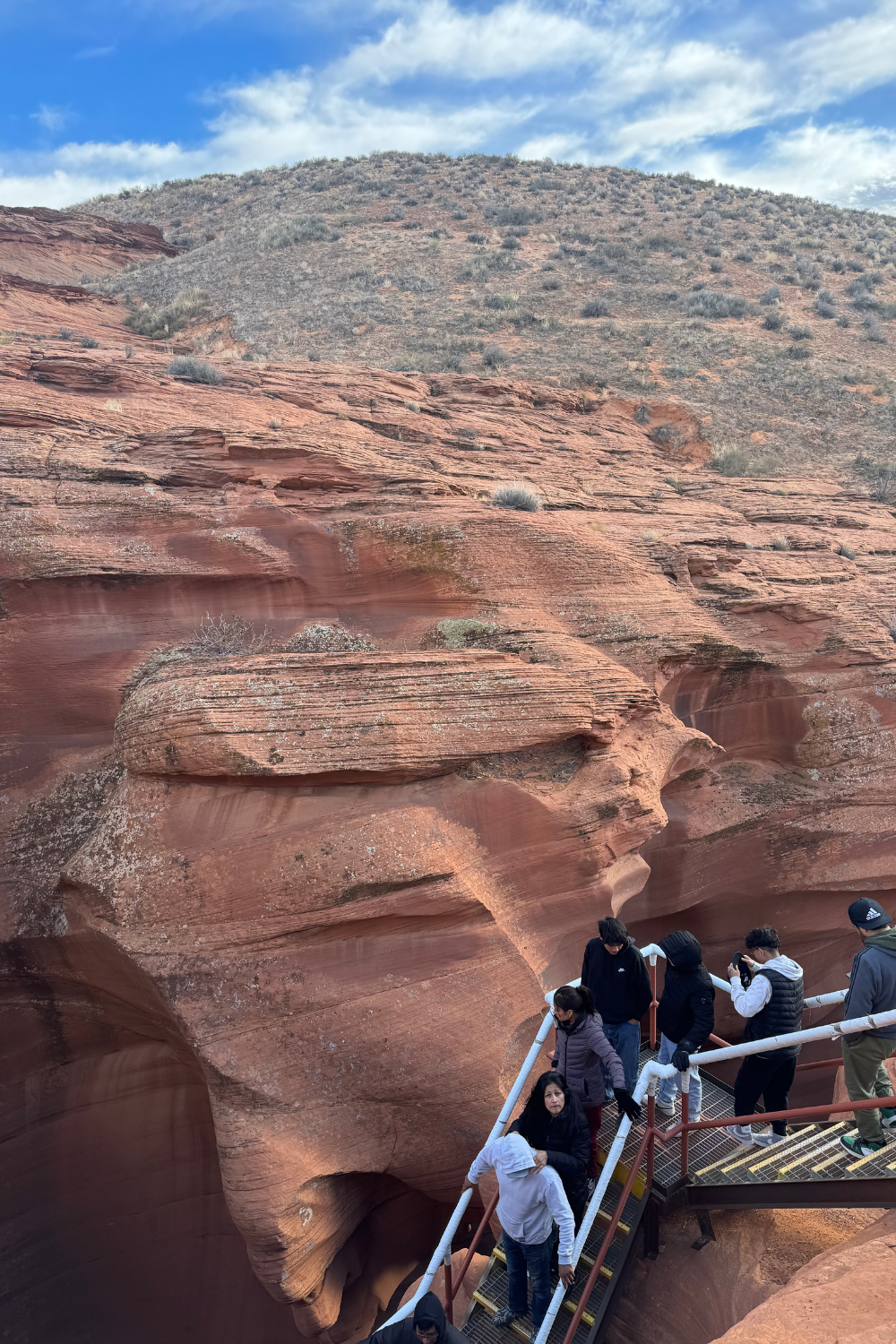 photo of a group climbing into antelope canyon