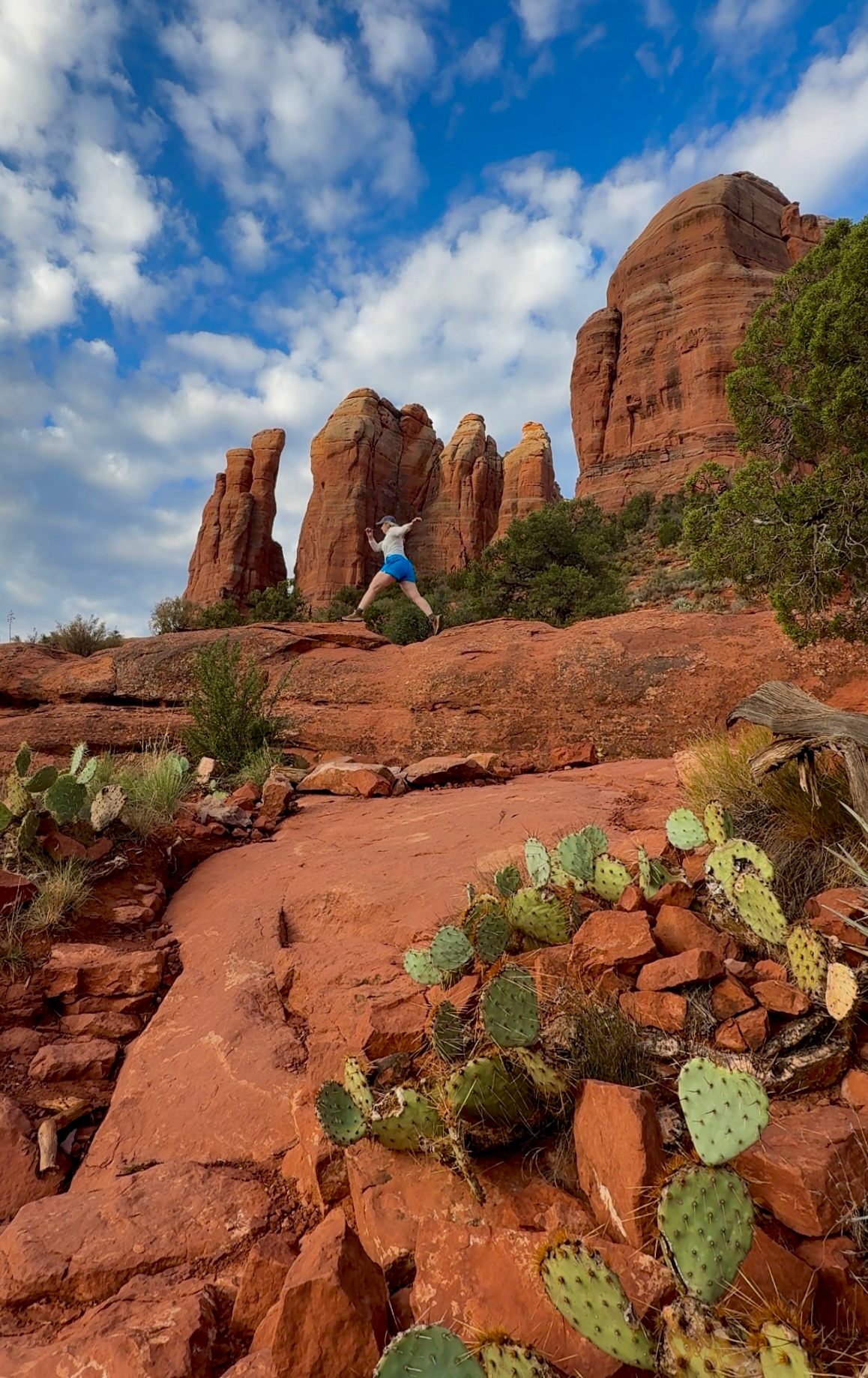 photo of a girl hiking in red rocks