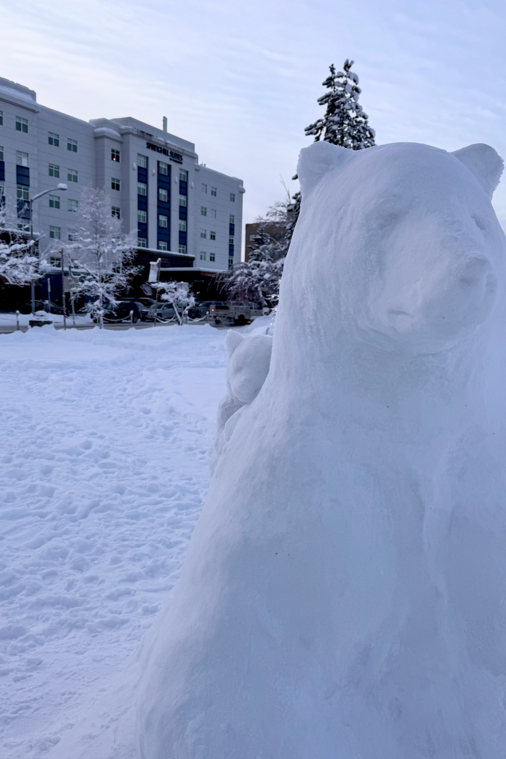 hotel in fairbanks next to a polar bear snow sculpture