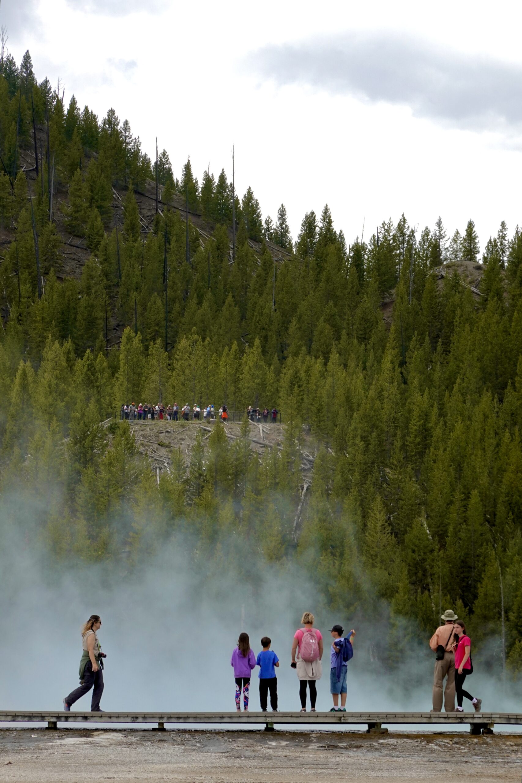 photo of people on the grand prismatic overlook and boardwalk in yellowstone