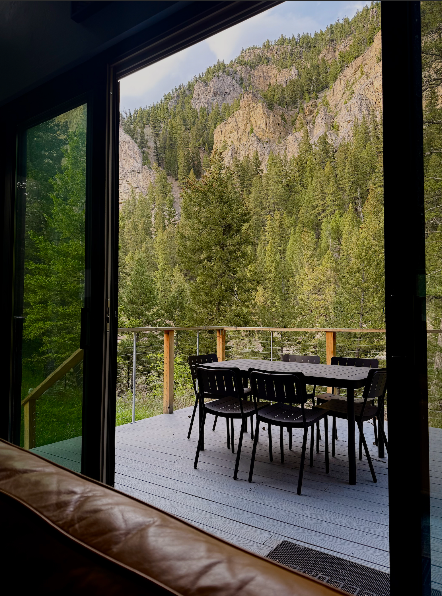 Mountain view from a cabin deck at a place to stay in Bozeman, Montana